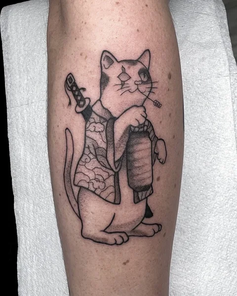 Cat dressed as a samurai with a sword, tattooed by Brodie Bailey